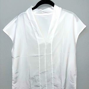Solid white, v neck blouse.